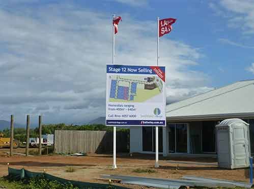 A Building Under Construction With A For Sale Sign In Front Of It — Cairns Signcorp In Portsmith, QLD