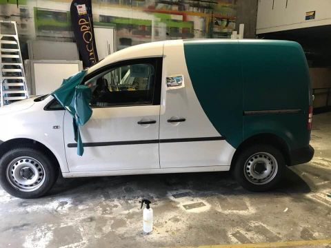 A White And Green Van Is Parked In A Garage — Cairns Signcorp In Portsmith, QLD