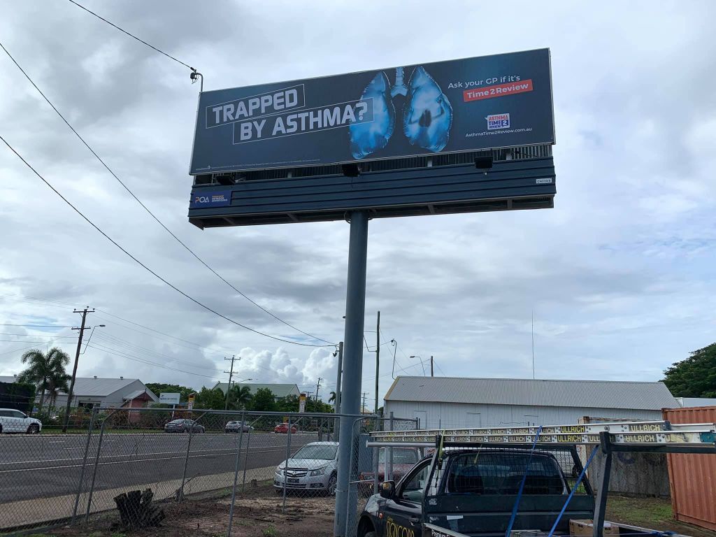 A Billboard On A Pole That Says Trapped By Asthma — Cairns Signcorp In Portsmith, QLD