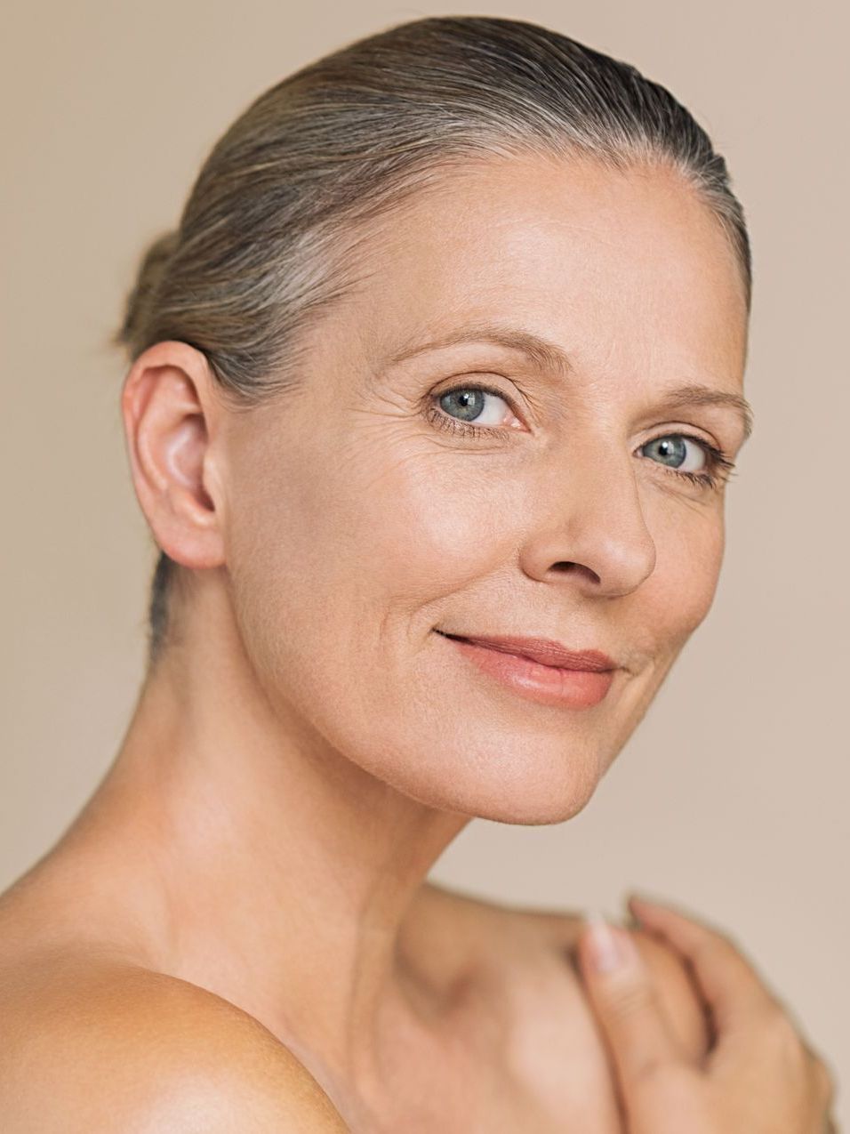 A close up of a woman 's face with a smile on her face.