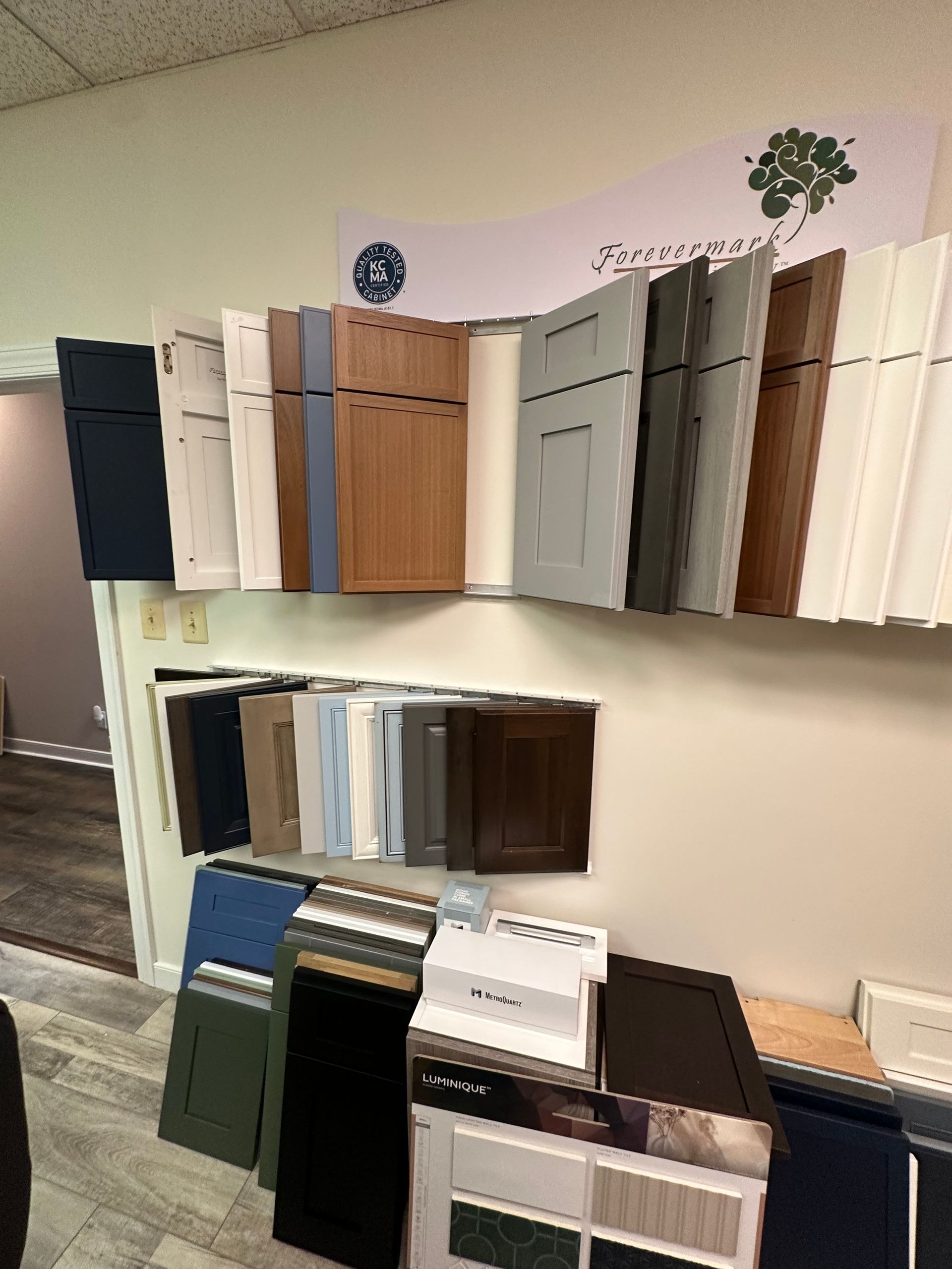 Cabinet door samples on display in various colors and styles.
