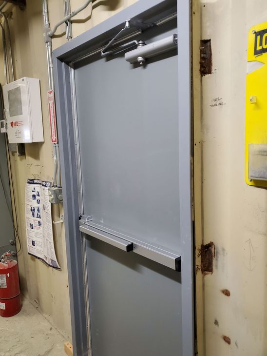 A close up of a door with a handle and a lock.