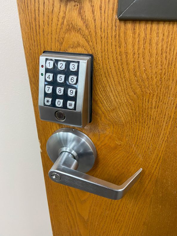 A close up of a door with a handle and a lock.