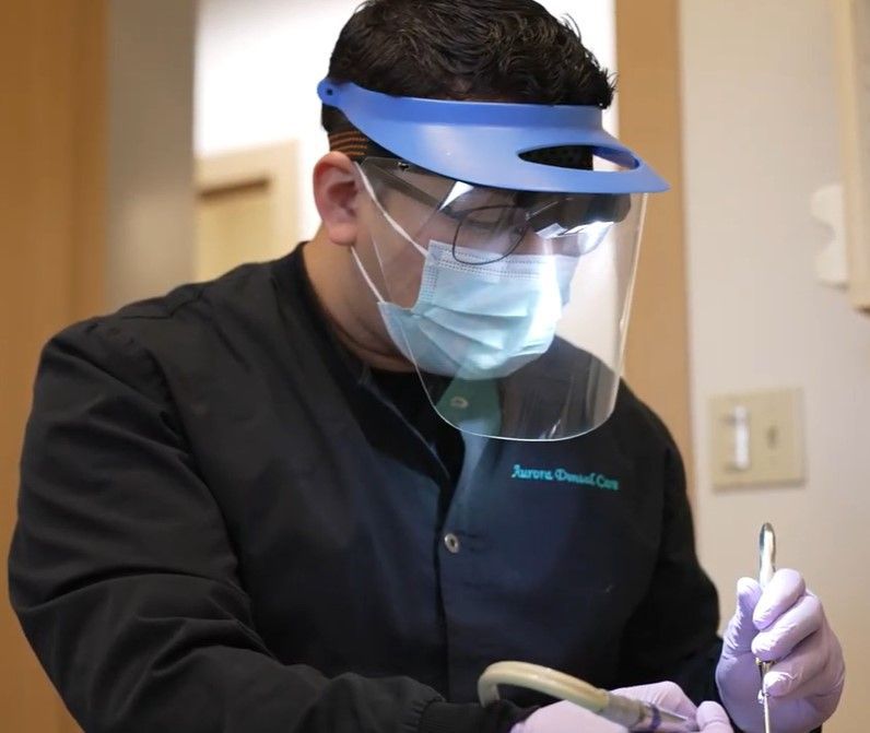 staff member cleaning a Seattle, WA patient's teeth