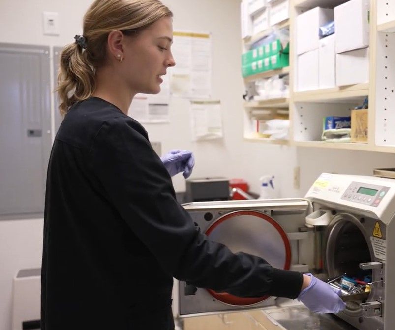 staff member using equipment in our Seattle Dental Practice