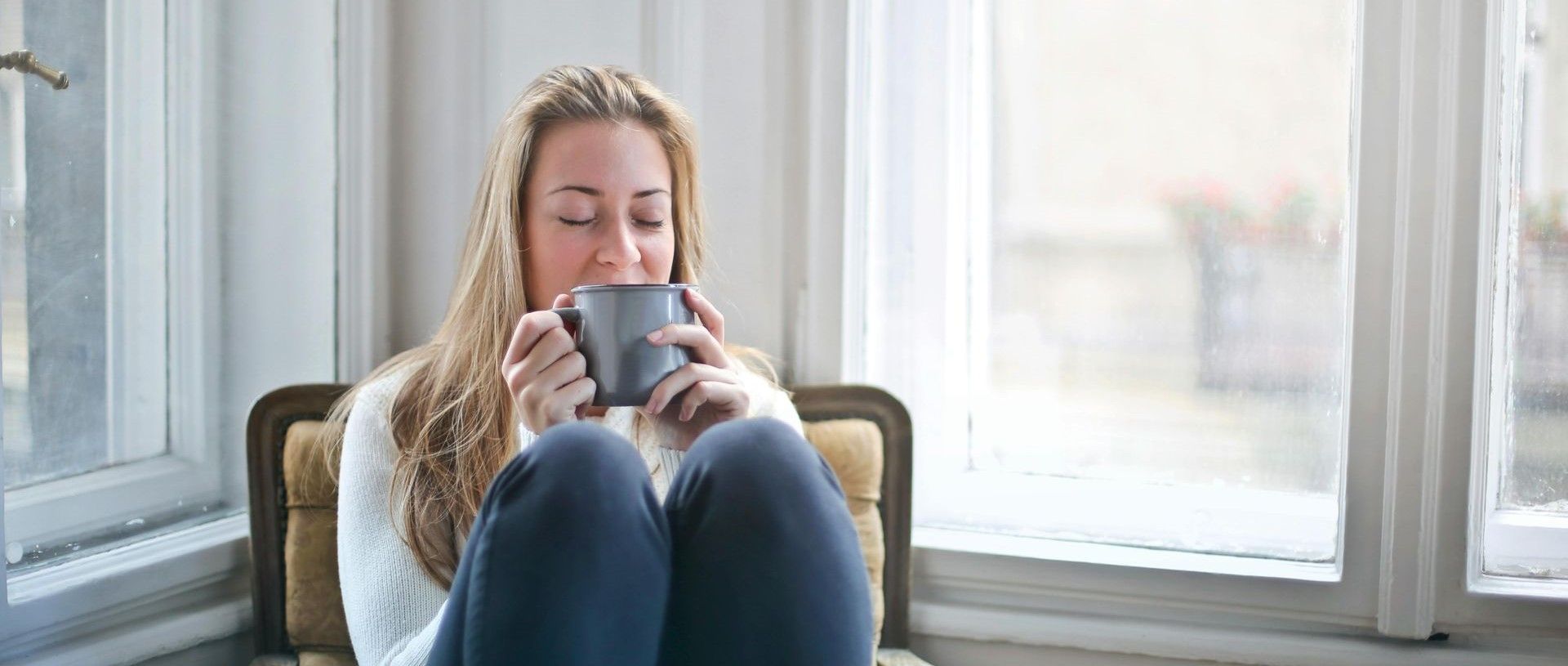 Woman in Seattle drinking coffee