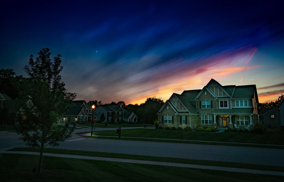 A brand new residential neighborhood at sunset with freshly paved asphalt roads in Milwaukee, WI.