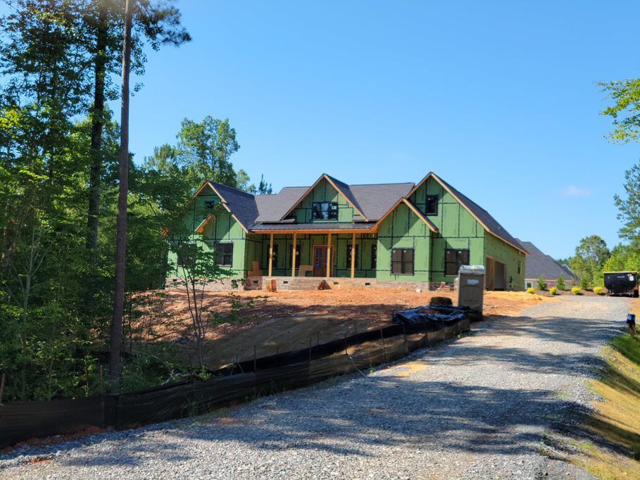 A house is being built in the middle of a forest.