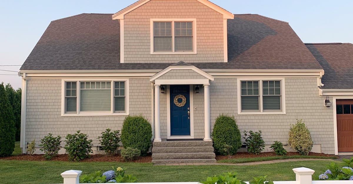 A house with a blue door and a wreath on it