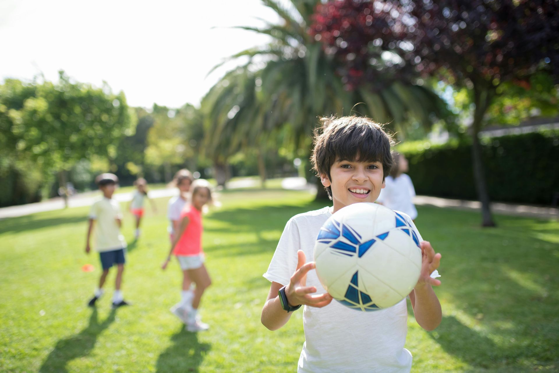 child holding a ball