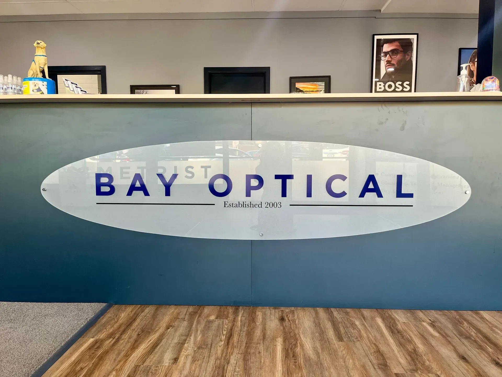 An eye exam in progress, showing a close-up of a patient's eye on a digital autorefractor screen.