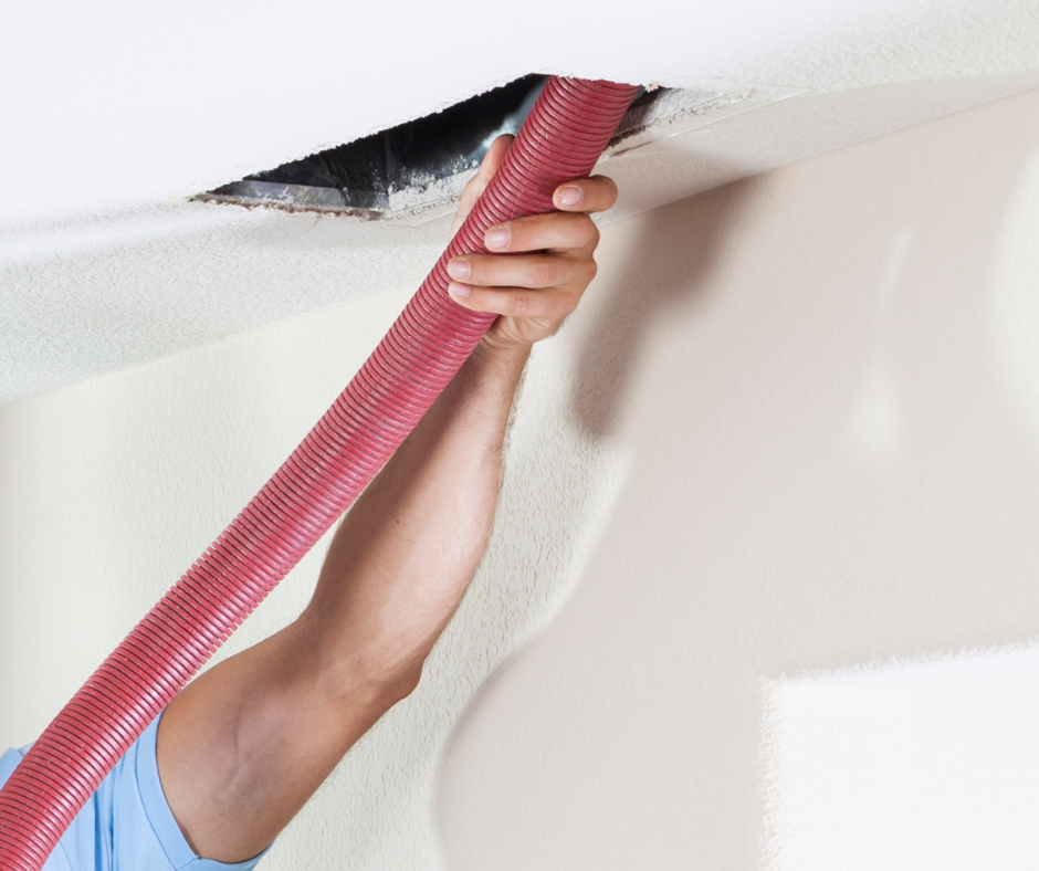 Professional duct cleaning services removing buildup from air duct system