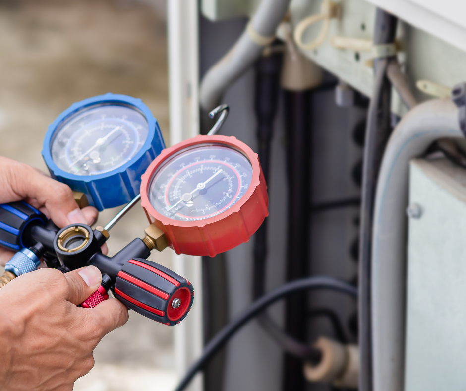 HVAC technician checking system pressure during HVAC maintenance service