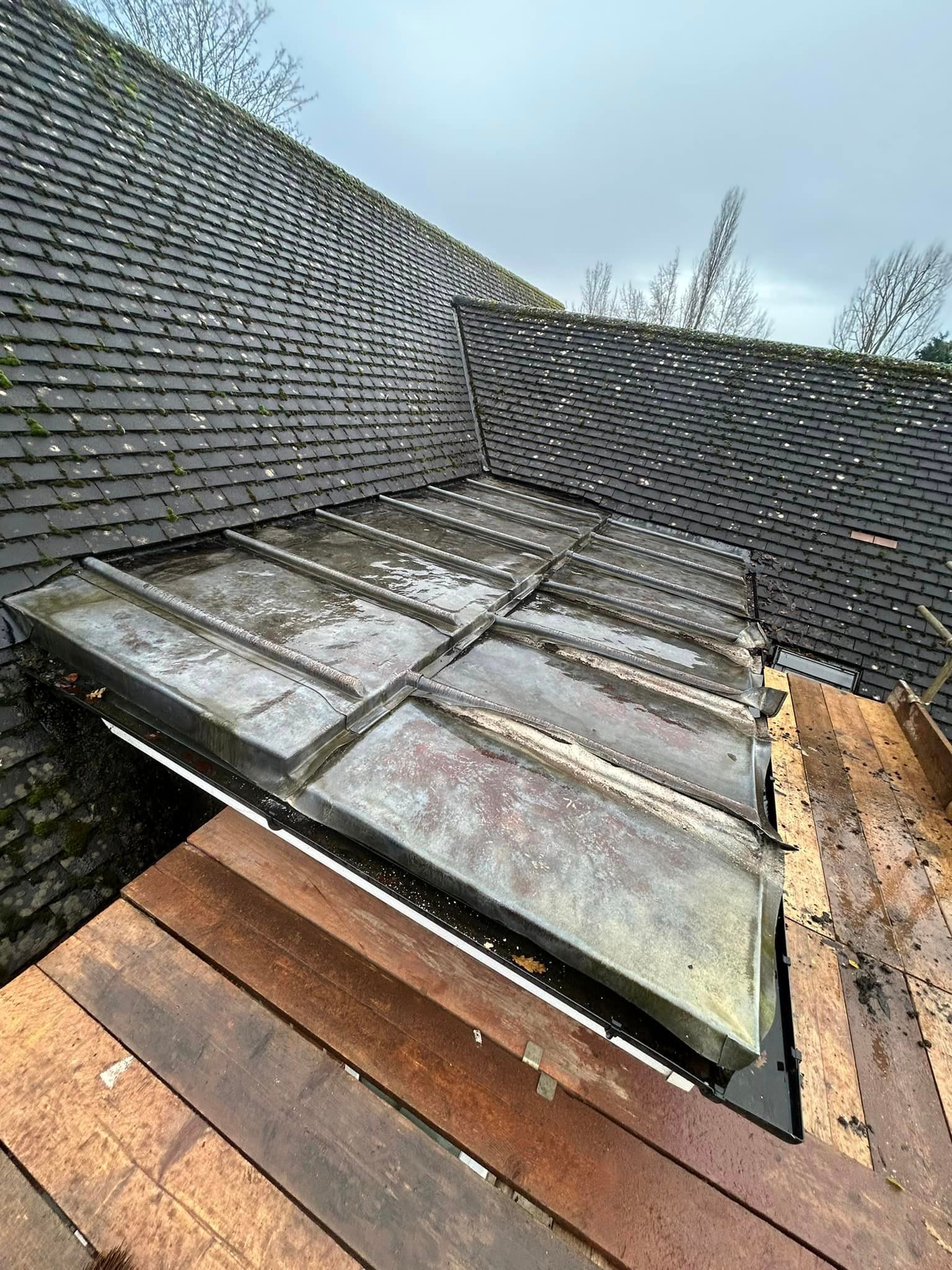 A roof with a wooden structural work while being repaired