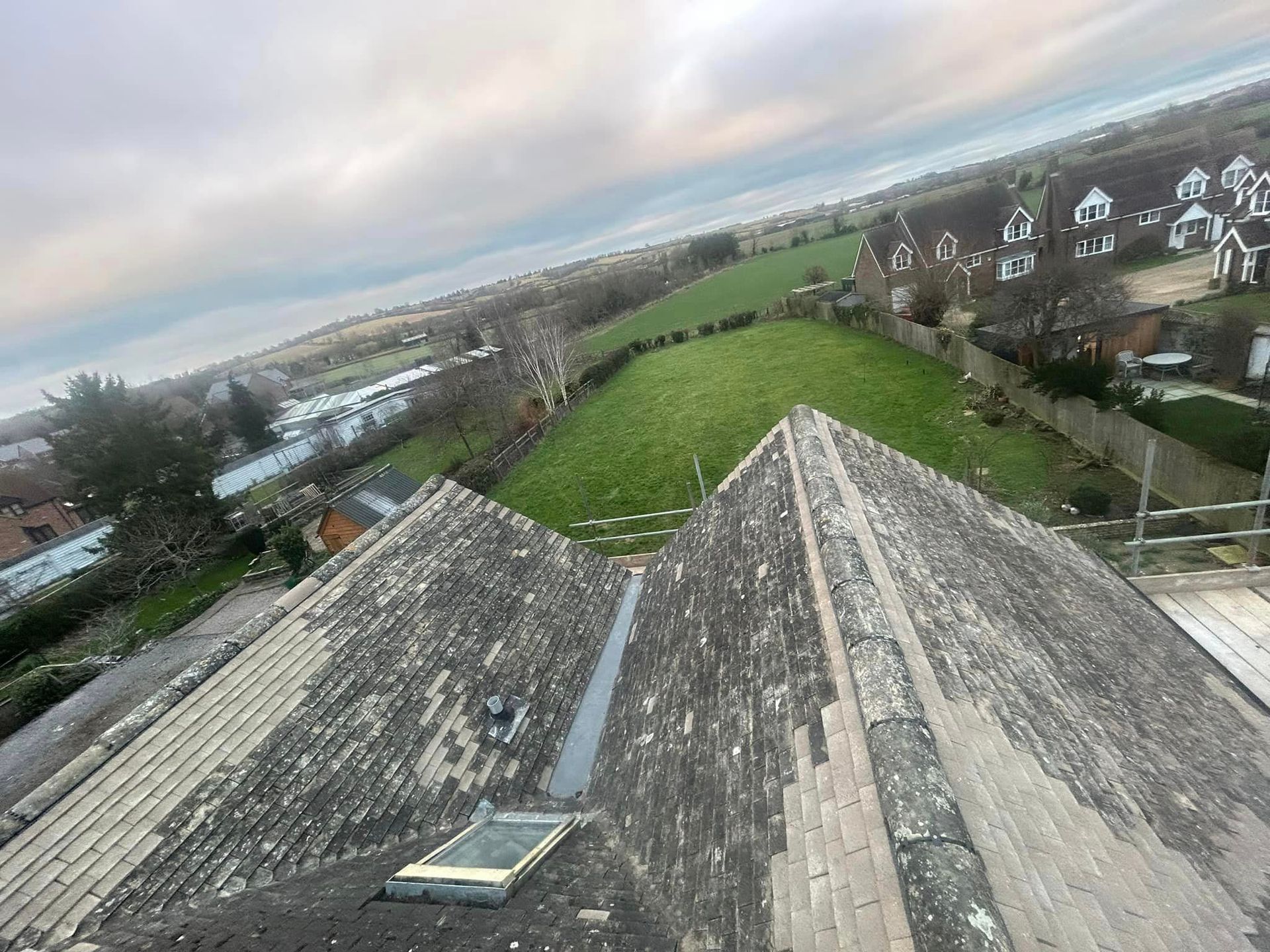 A view of a roof from the top of a building.