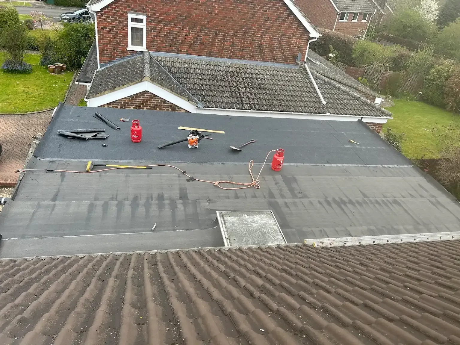 An aerial view of a roof with tools on it.