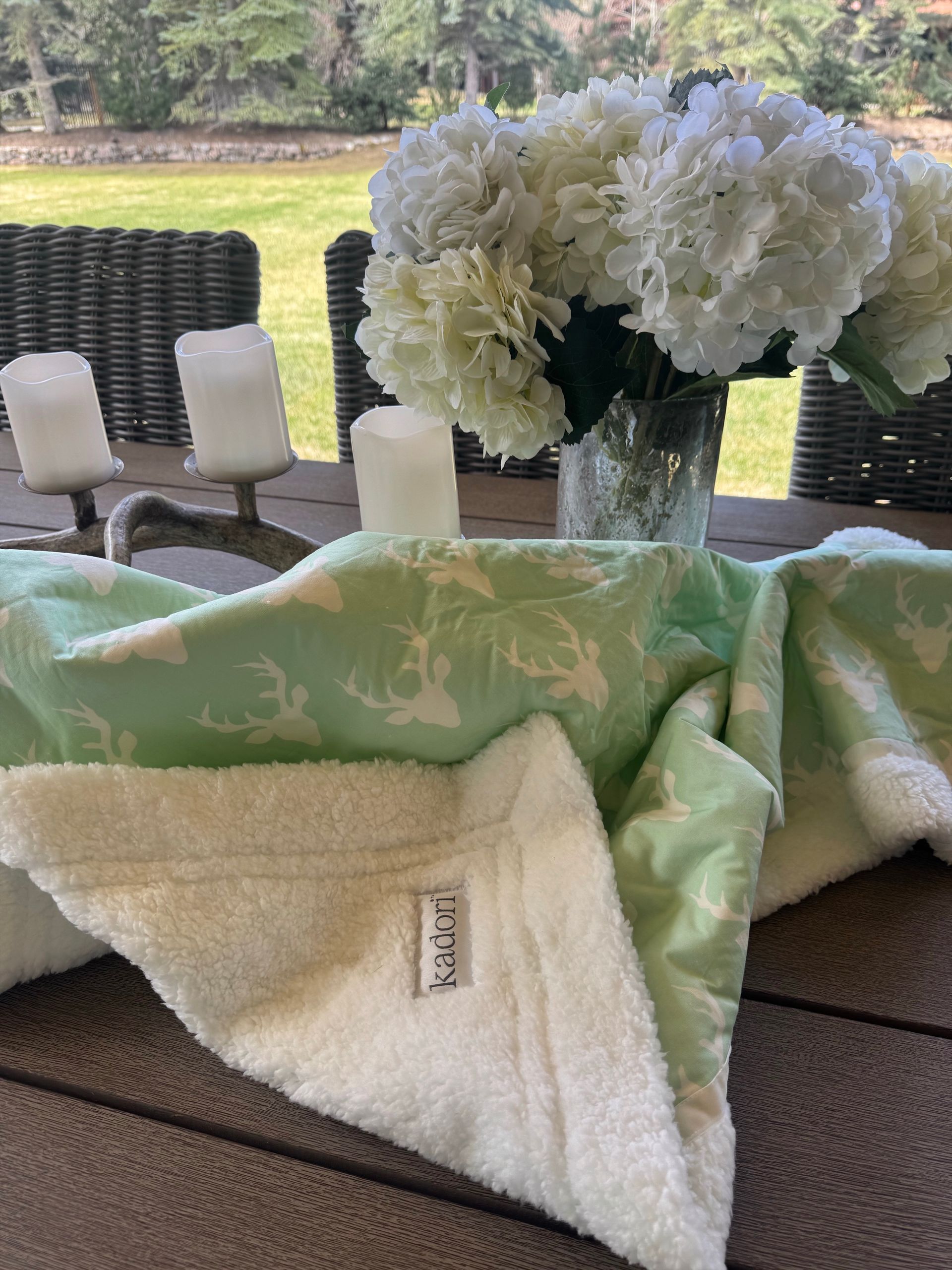 kadori blanket with white antler on mint green background design