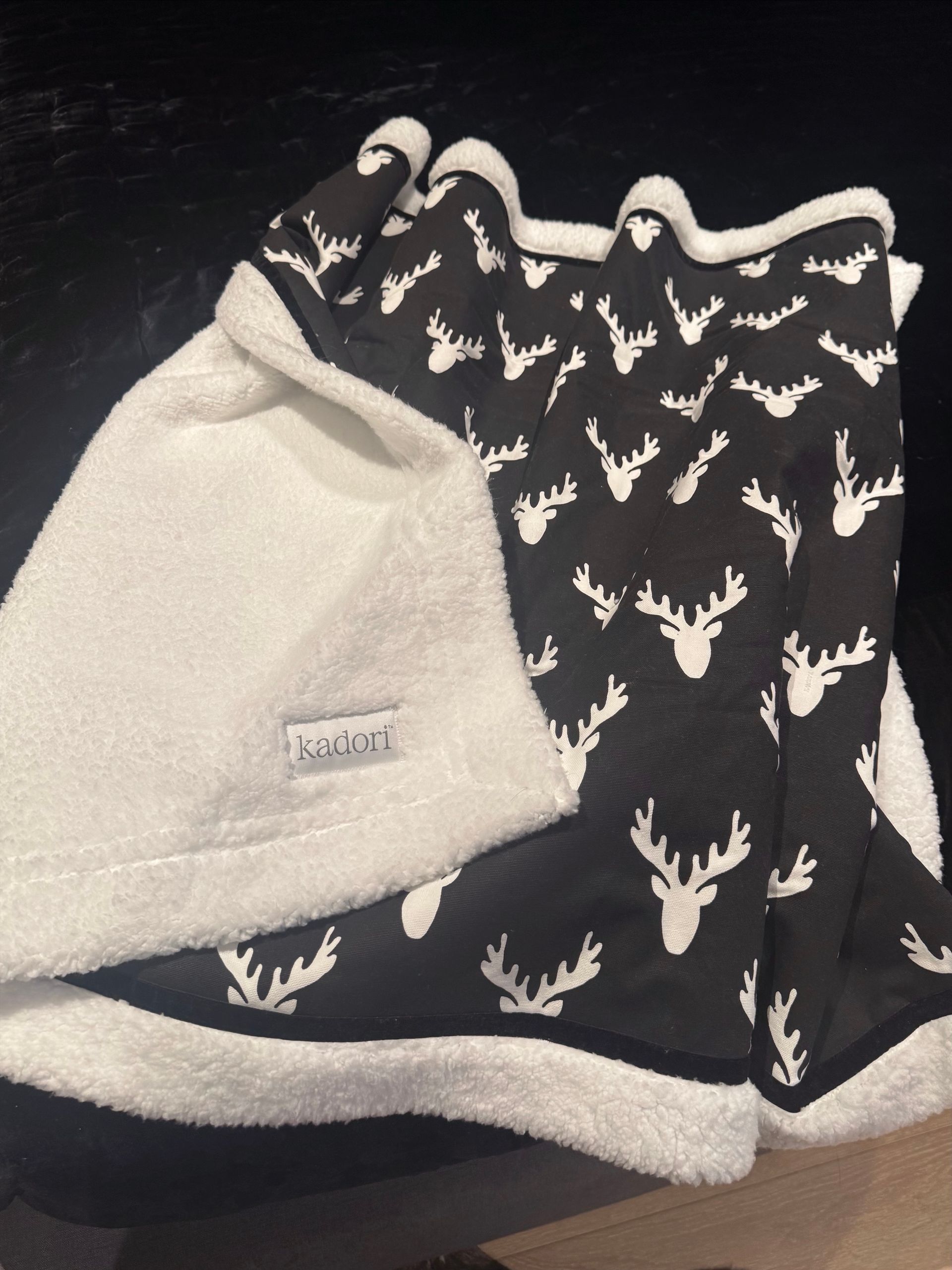 kadori blanket with white antler on black background design