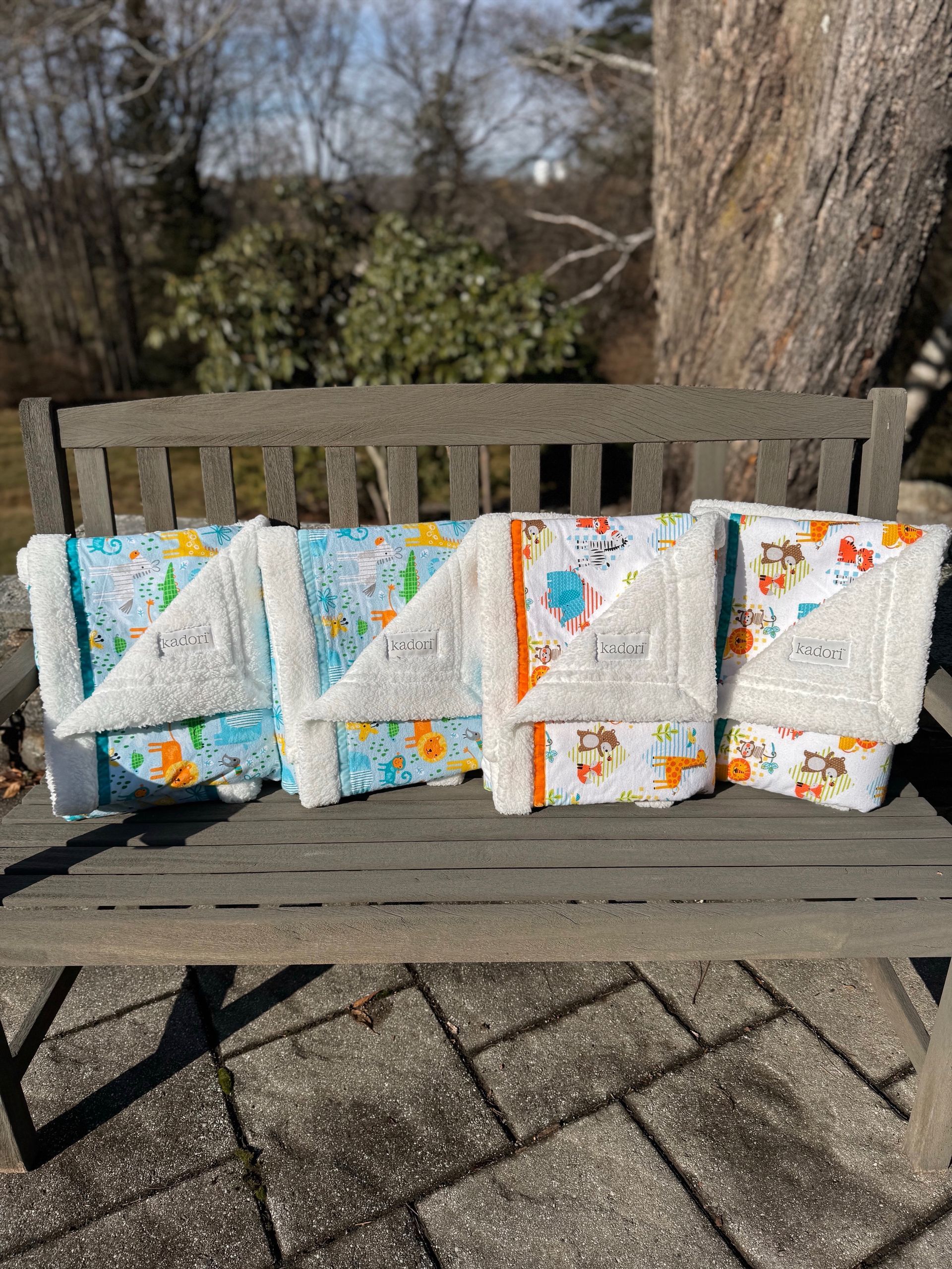 kadori sherpa baby blanket with bright jungle animal printed material