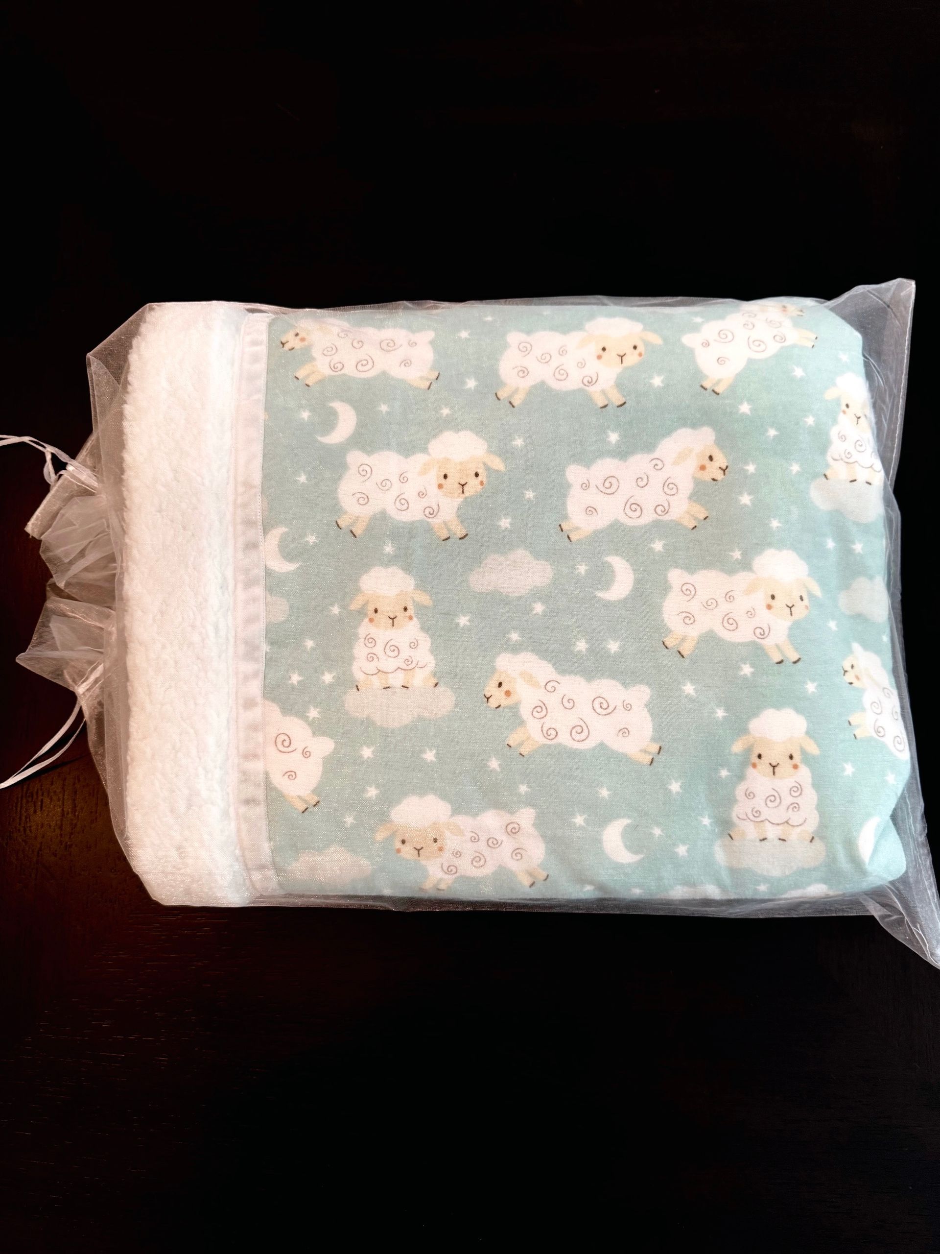 sleepy sheep material blanket in bag