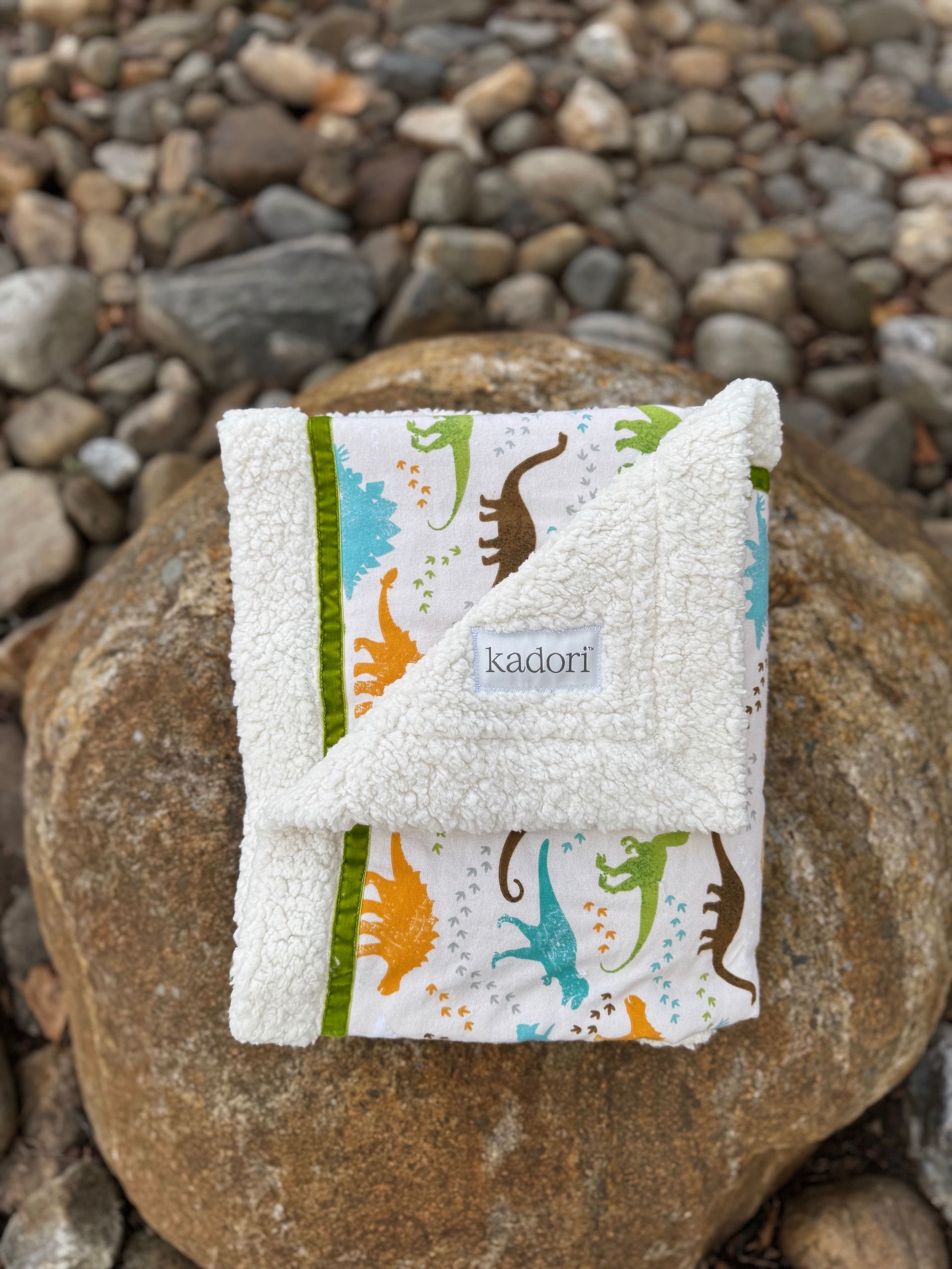 kadori sherpa baby blanket with printed pastel dinosaurs