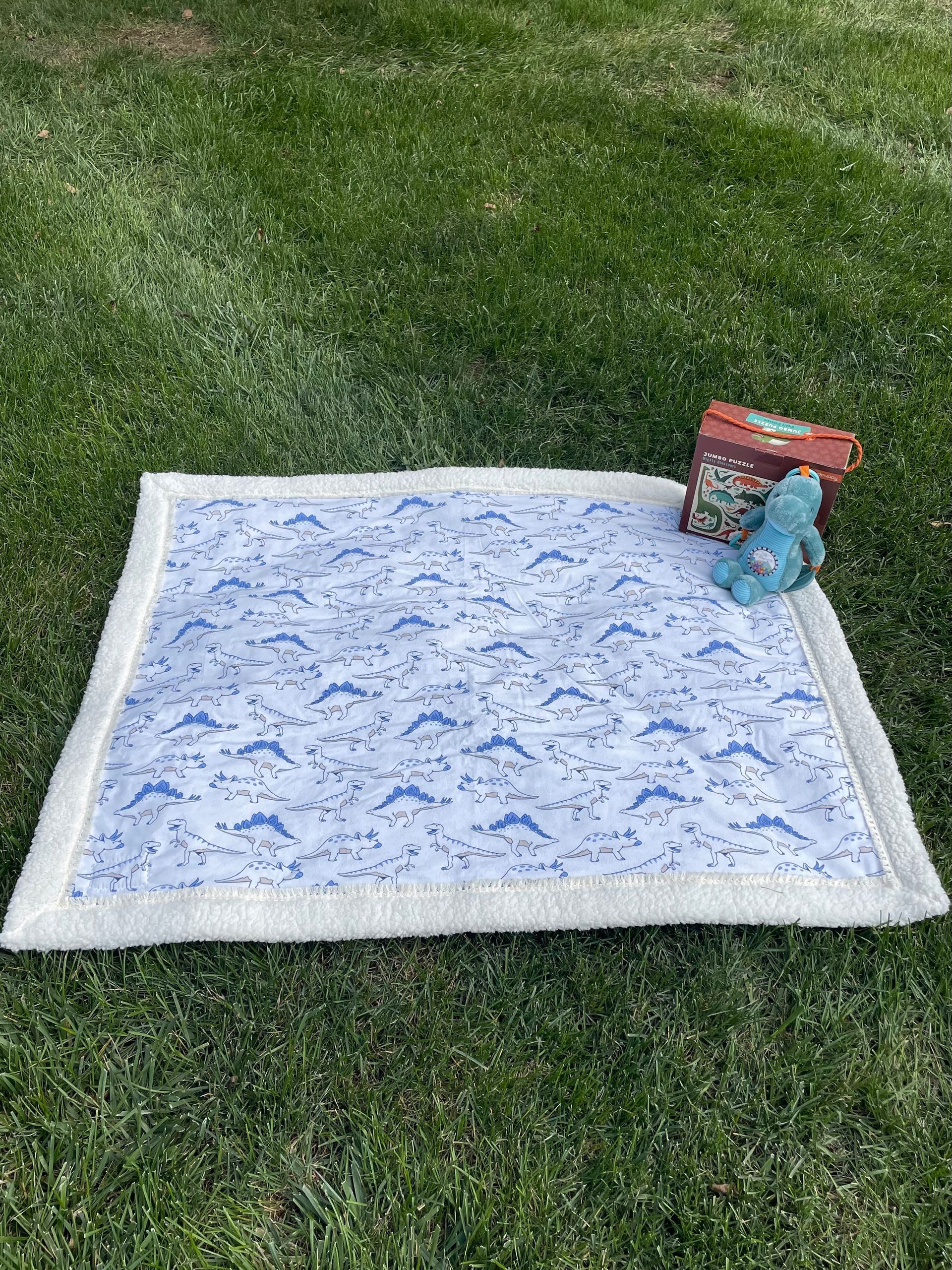 Dinos on Cream printed sherpa balnket