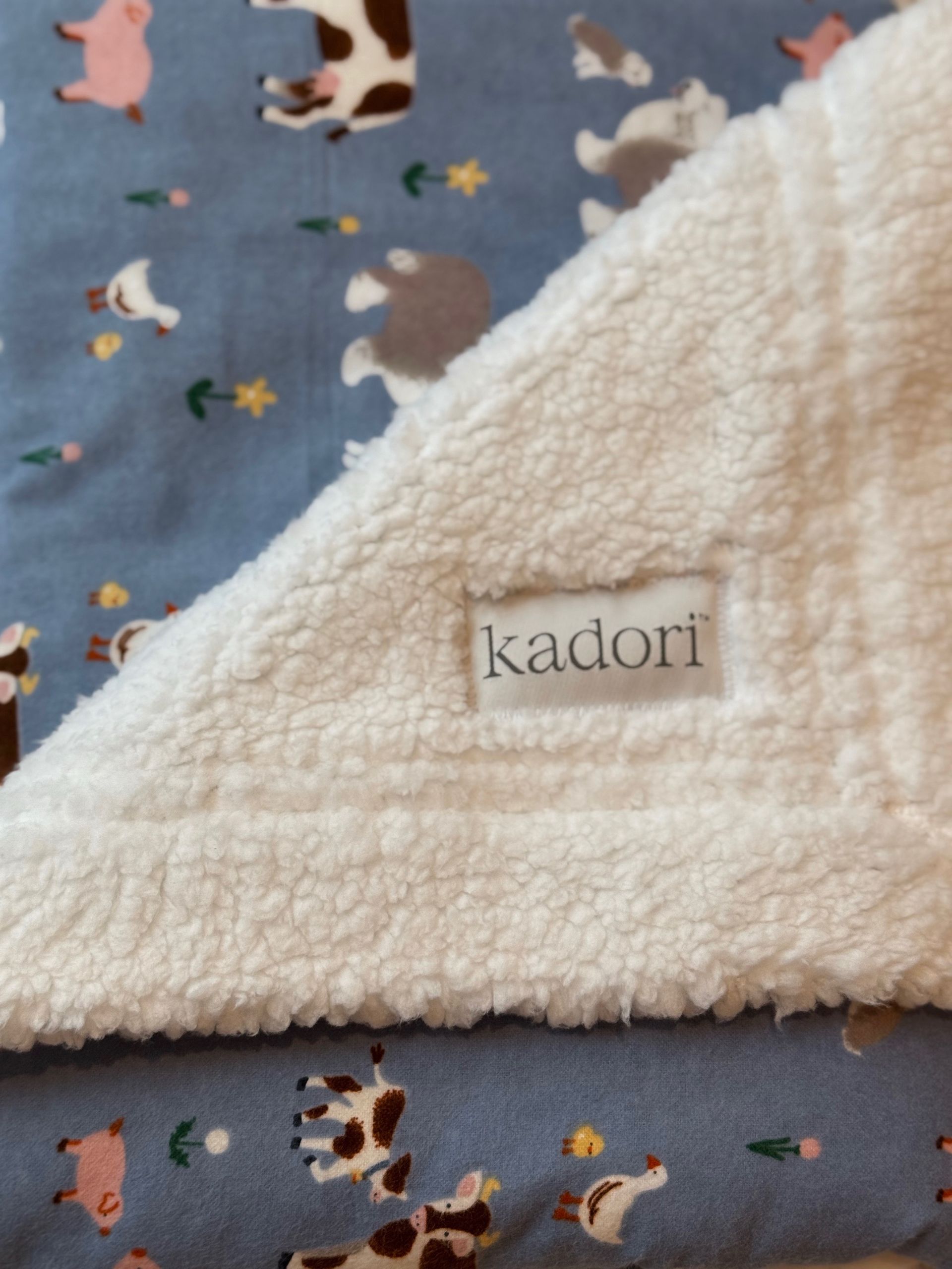 kadori sherpa baby blankets with printed materials in gift wrapping