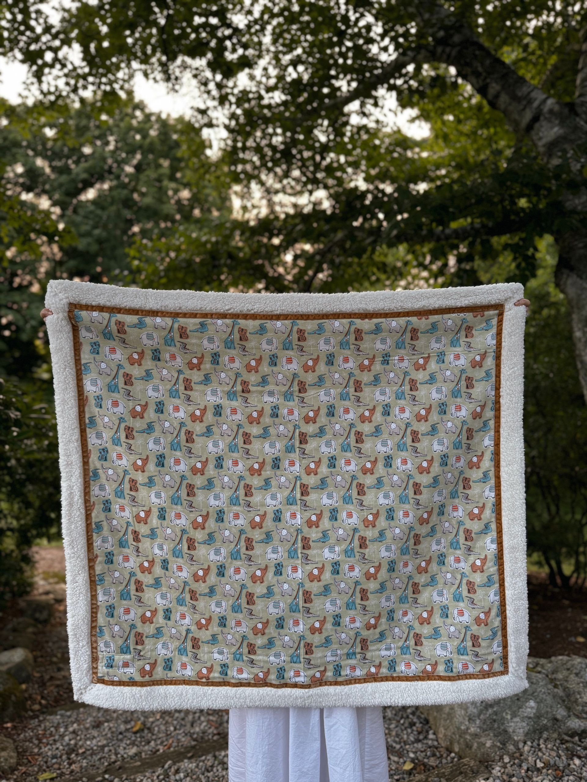 blanket with jungle animal print all over