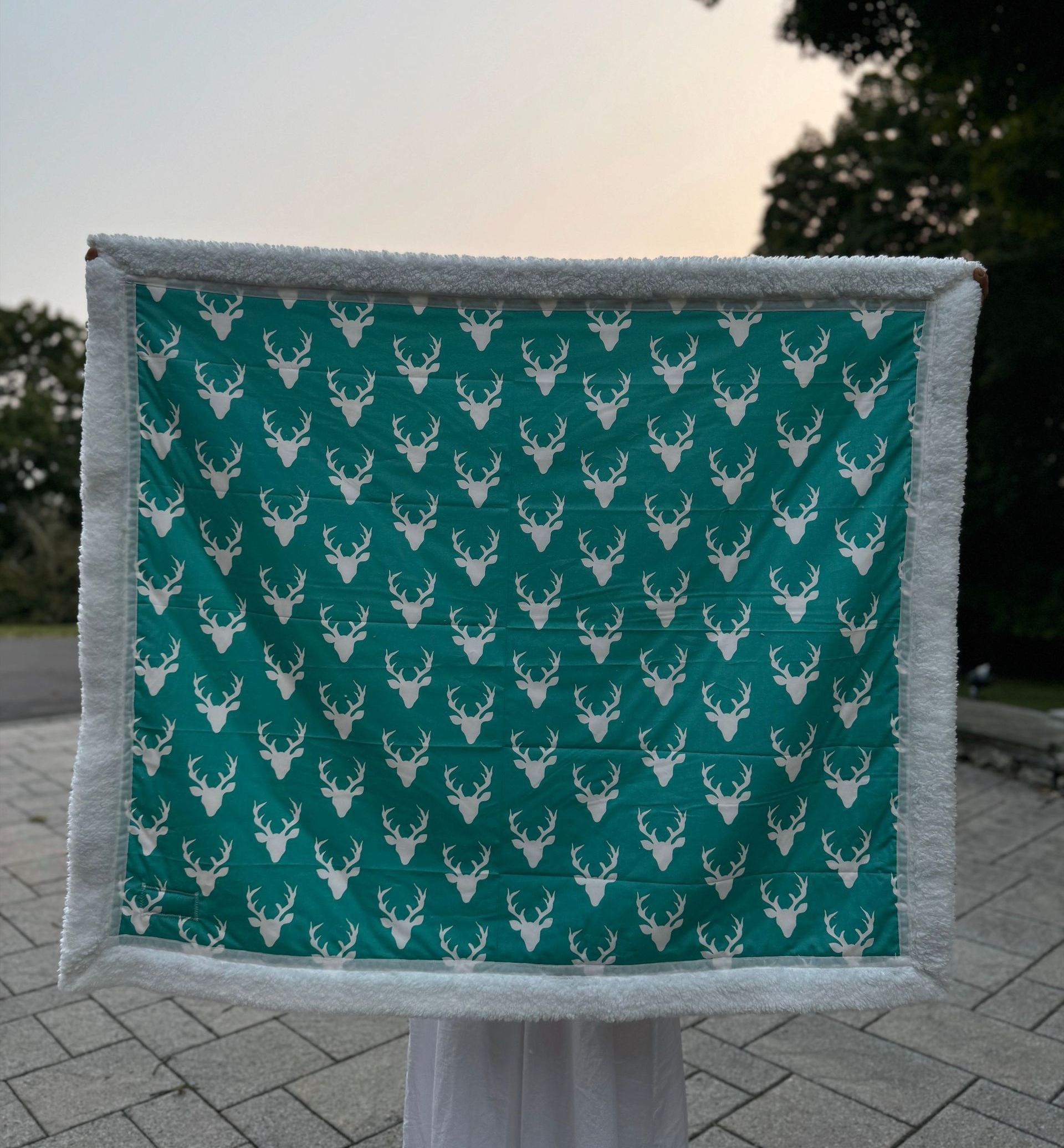 teal background antler fabric blanket