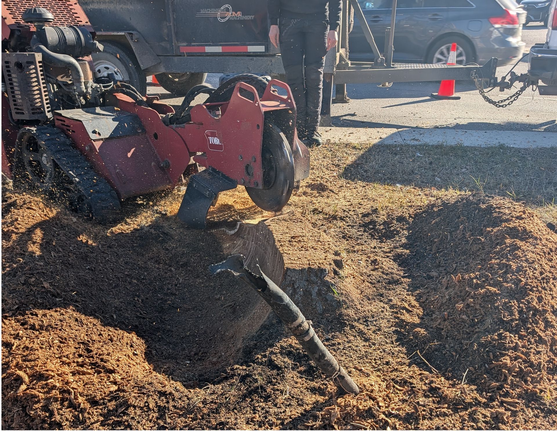 Image of a stump grinding machine in action.