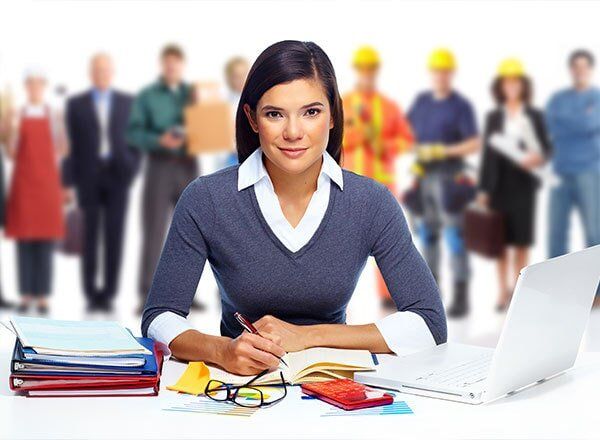 Young Lady Holding A Pen With Books — Financial Services in Wollongong NSW