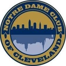 Notre Dame Club of Cleveland logo: gold circle, blue skyline, reflecting in blue water. Text: "Notre Dame Club of Cleveland."