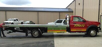 Truck towing a car - towing service in Cortland, OH