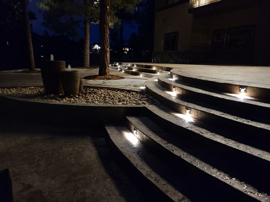 A set of stairs that are lit up at night