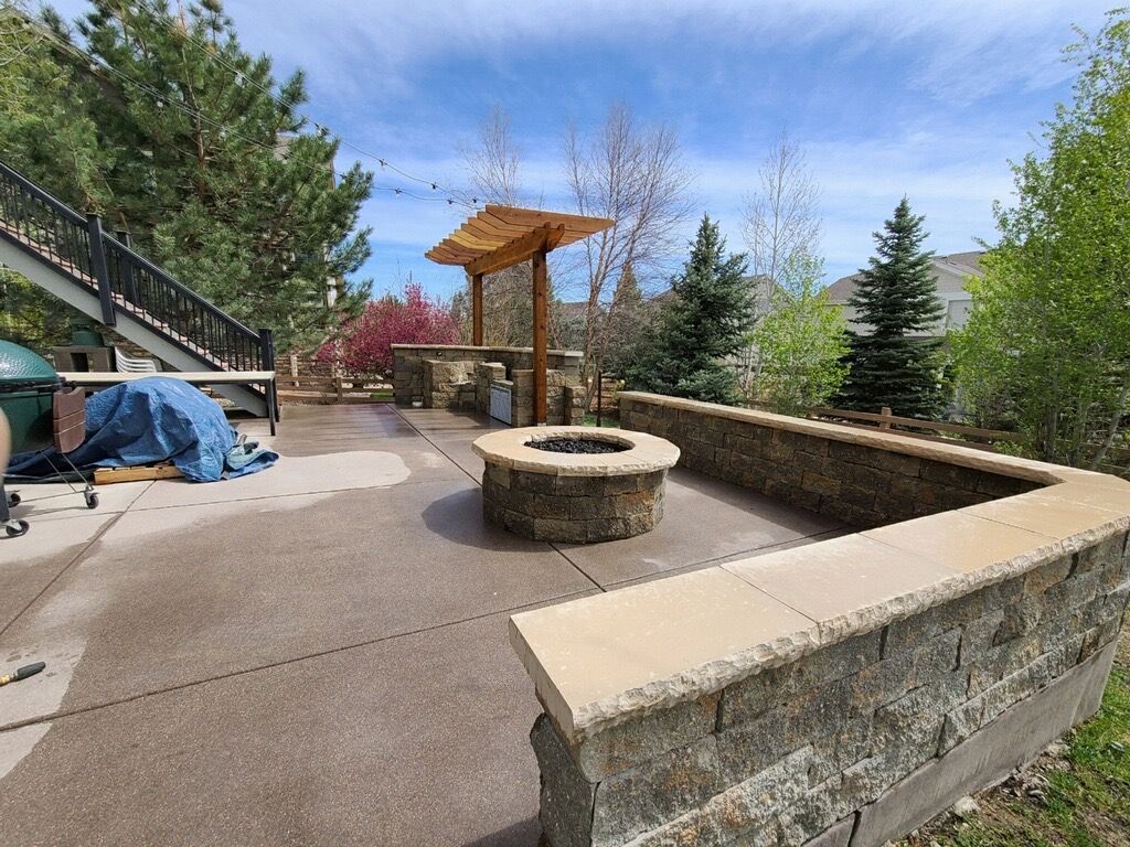 There is a fire pit in the middle of the patio.