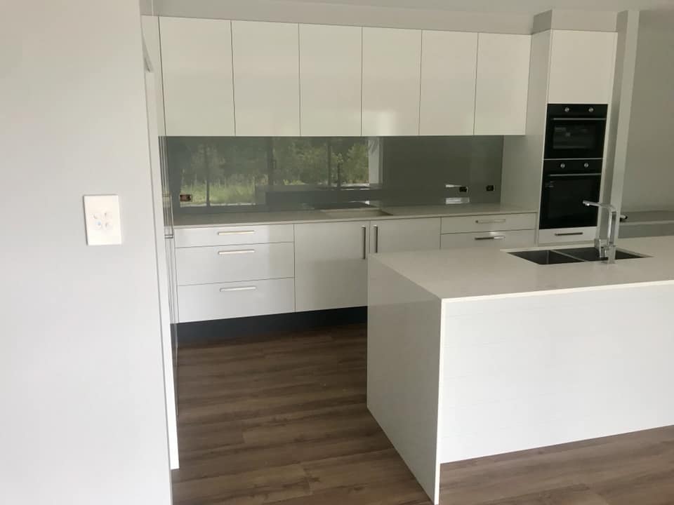 White Kitchen With Grey Splashback — Your Expert Glaziers in Coffs Harbour, NSW