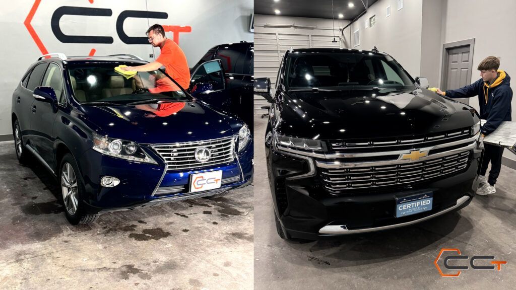 A man is cleaning the windshield of a blue car and a black suv.