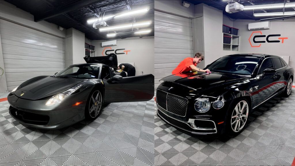A man is cleaning a car in a garage.