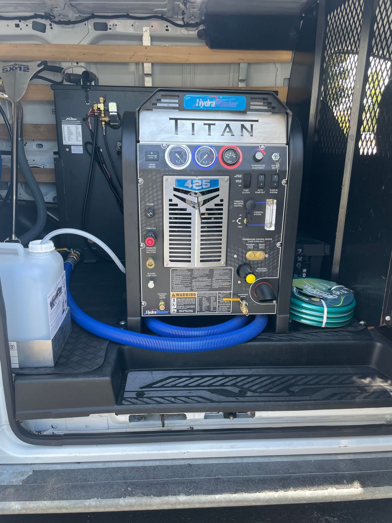 A carpet cleaning machine labeled 