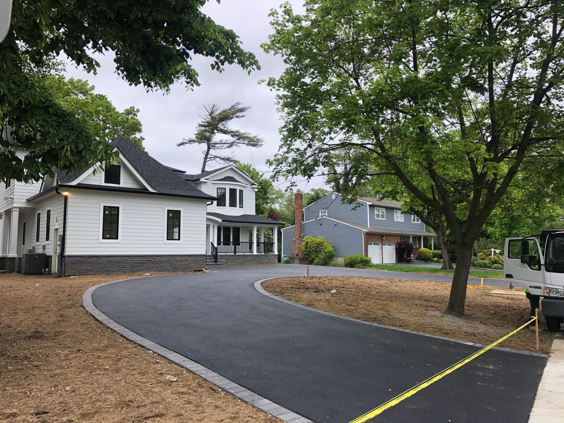 White House with a Wide Road — Westbury, NY — A&M D’Alessandro Contractors Inc.