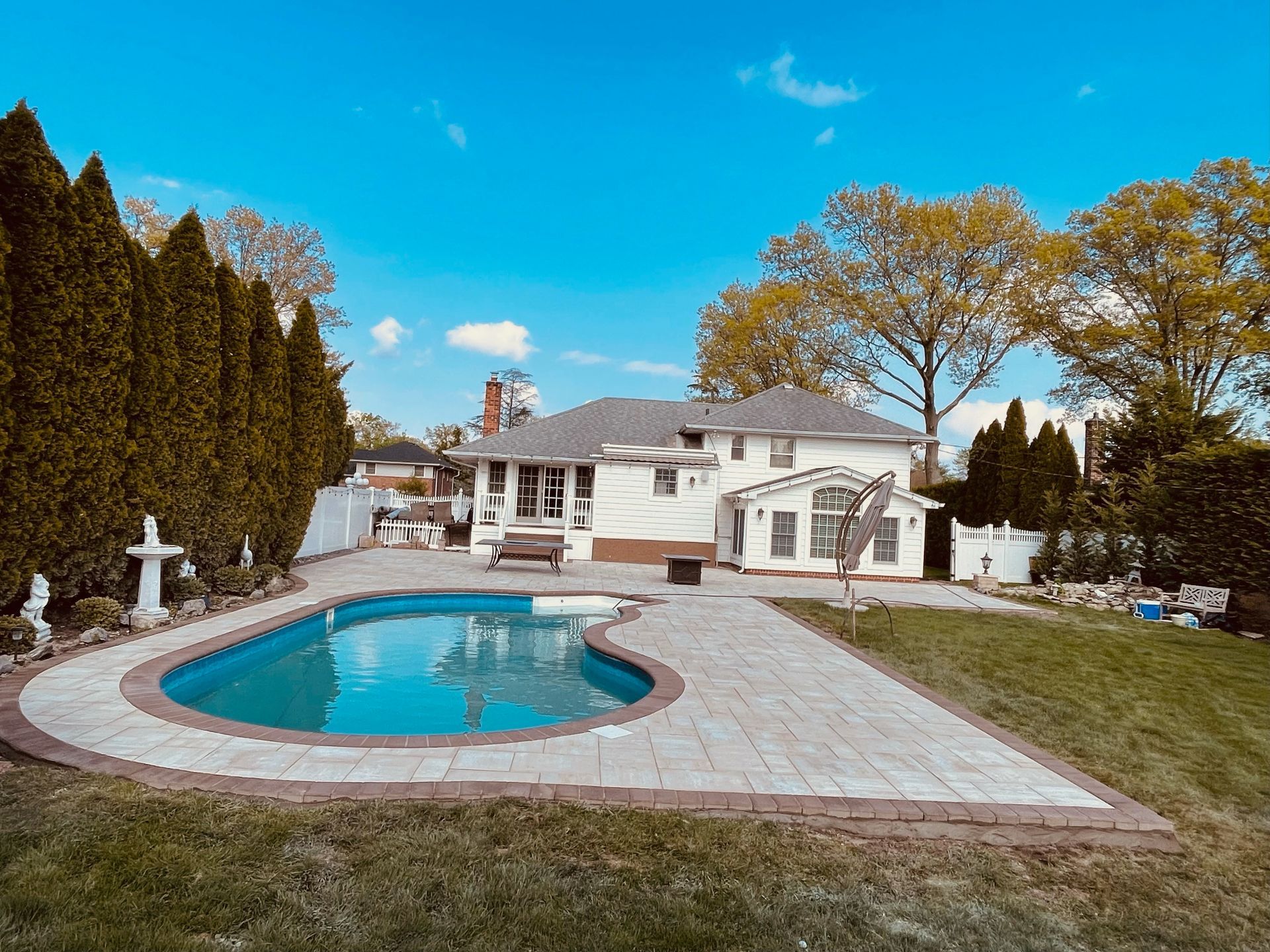 White House with a Curvy Pool — Westbury, NY — A&M D’Alessandro Contractors Inc.