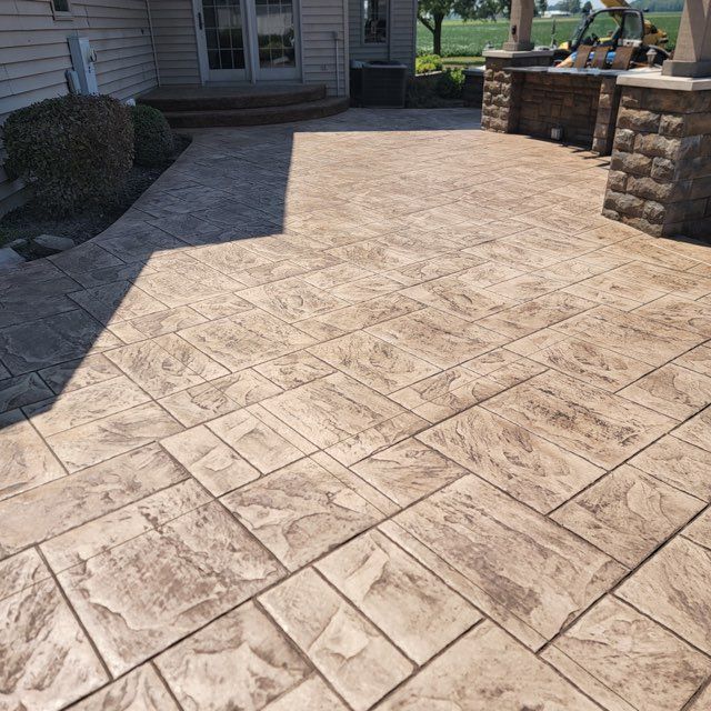 A patio with a brick pattern on it