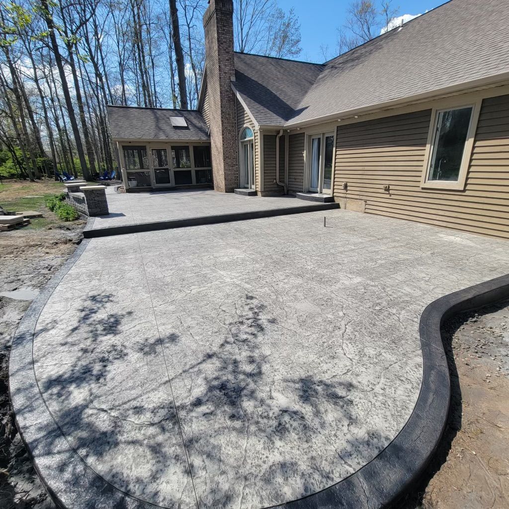A large house with a large patio in front of it