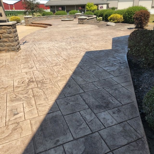 A patio with a shadow of a person on it