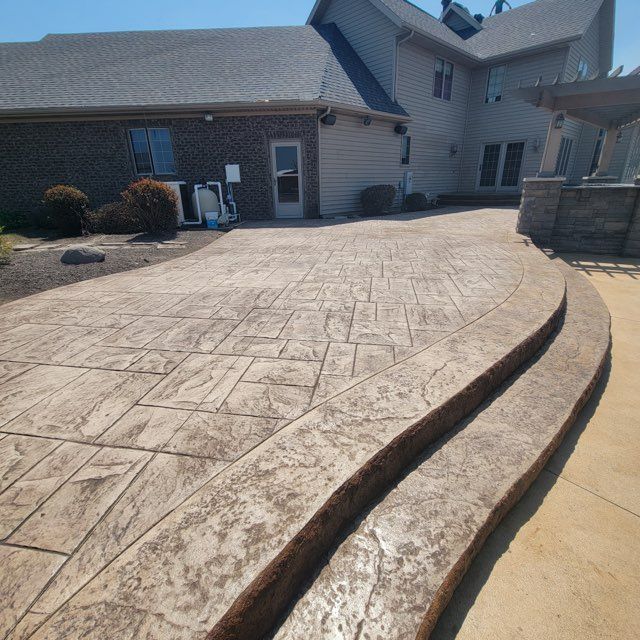 A large house with a curved driveway in front of it