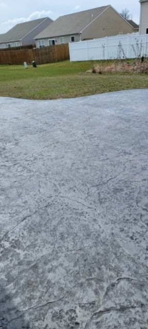 A wide concrete driveway of a house