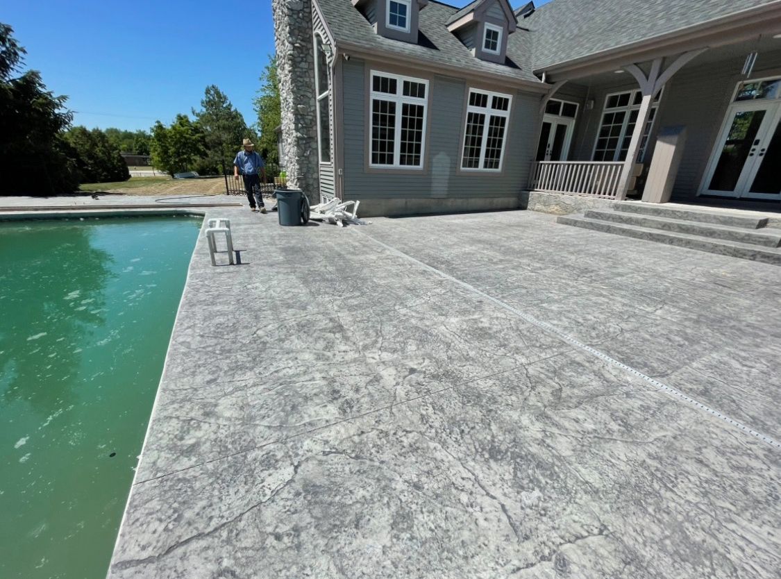 A large house with a nice swimming pool in front of it