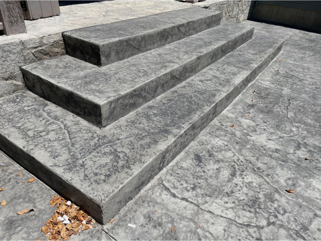 A set of concrete steps leading up to a building