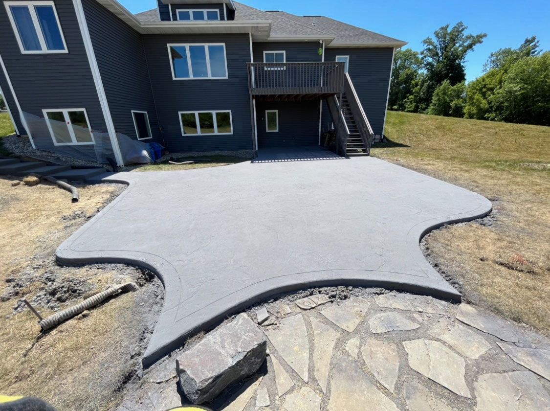 A large house with a unique design of a concrete patio