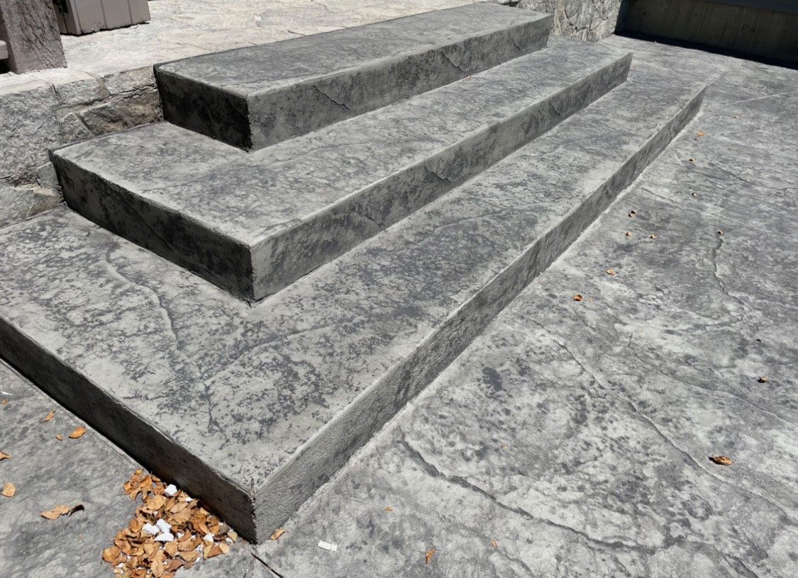 A set of concrete steps leading up to a building